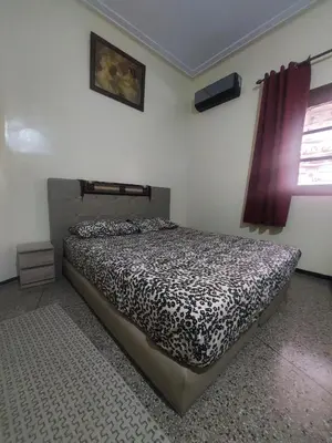 a bedroom with a bed in a room at Studio Hamria Meknes in Meknès