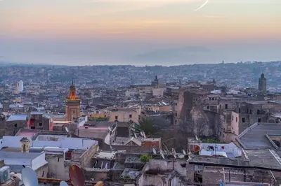 a view of a city at sunset at Riad Fes - Relais & Châteaux in Fès