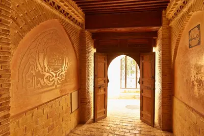 an empty hallway with an archway in a building at Riad Fes - Relais & Châteaux in Fès