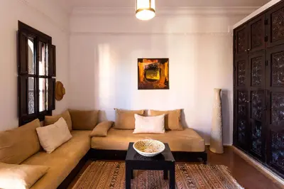 a living room with a couch and a table at Kasbah Caracalla in Aghmat
