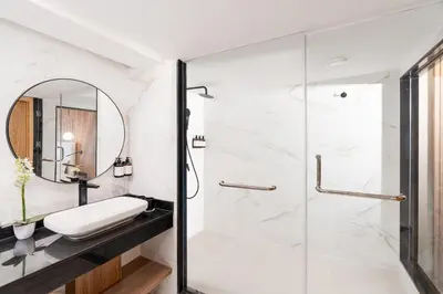 a bathroom with a shower and a sink at Kenzi Rissani in Er Rachidia