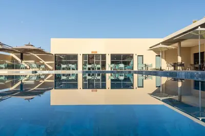 a view of a building with a swimming pool at Kenzi Rissani in Er Rachidia