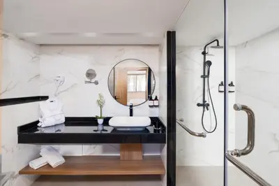 a bathroom with a sink and a shower at Kenzi Rissani in Er Rachidia