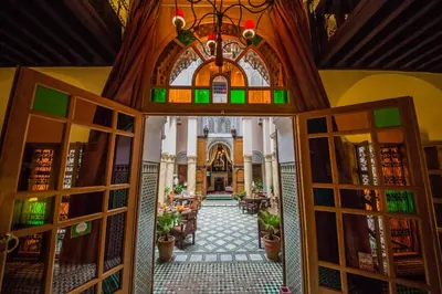 an open door into a building with a restaurant at Dar victoria in Fès