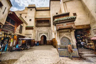a man standing in front of a building at Dar victoria in Fès