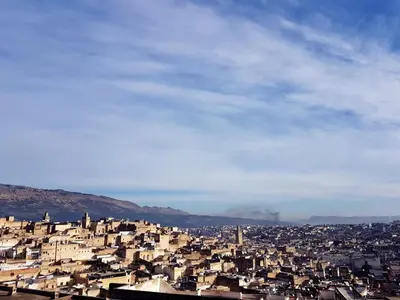 a view of a city with buildings on a hill at Riad Souafine in Fès