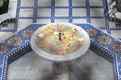 a donut in a bowl with sprinkles on a table at Riad Souafine in Fès