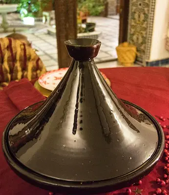 a silver vase sitting on top of a table at Riad Souafine in Fès