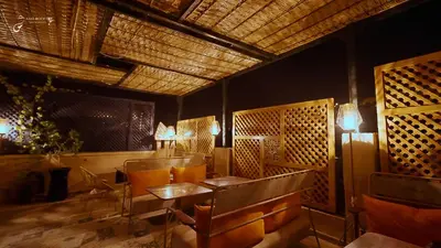 a restaurant with tables and chairs in a room at Riad El Amine Fès - Historic Hotels Worldwide in Fès