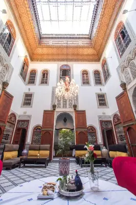 a large room with a chandelier in a building at Riad Fez Yamanda in Fès