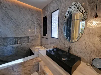 a bathroom with a large sink and a mirror at Palace Africa - Marrakech Palmeraie in Marrakech