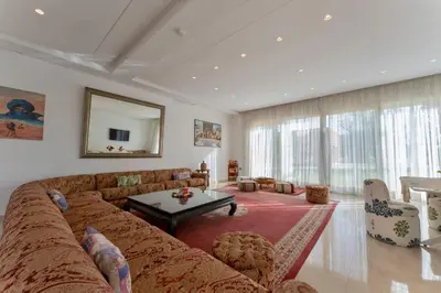 a living room with a couch and a table at Domaine Bahi in Marrakech
