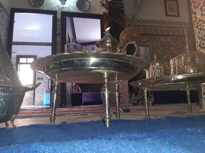 a silver sink in a room with a mirror at Mini Riad family Chez Adil Batha Fés in Fès