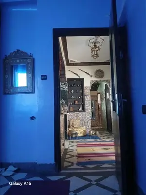 a doorway into a room with a blue light at Mini Riad family Chez Adil Batha Fés in Fès