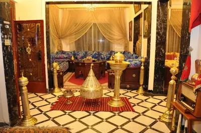 a living room with a couch and a table at Dar Aliane in Fès