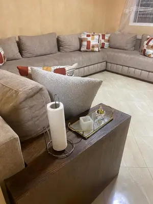 a living room with a couch and a table at Appartement chez Elmehdi in Fès