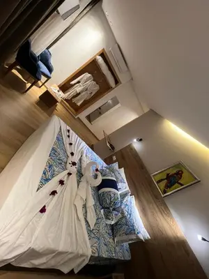 a bedroom with a bed with a wedding dress on it at Hotel beaux arts in Meknès