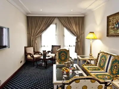 a living room with chairs and a table at Ramada By Wyndham Fes in Fès