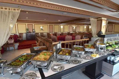 a buffet line with many different types of food at Les Mérinides in Fès