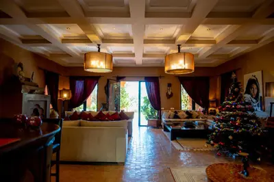 a living room with a christmas tree in the middle at Riad Al Mendili Private Resort & Spa in Had Abdallah Rhiat