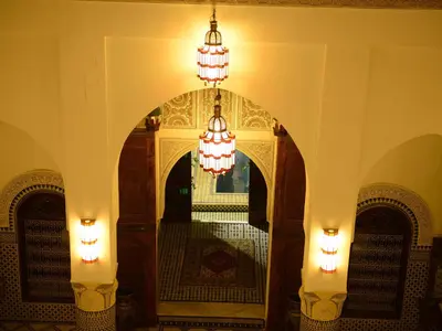 an entry to a building with two chandeliers hanging from it at Riad El Yacout in Fès