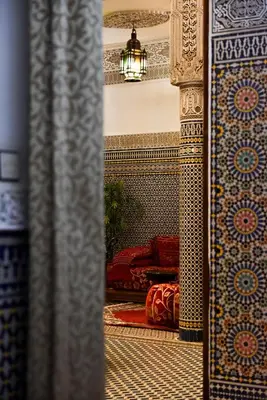 a view of a room with a bed and a mirror at RIAD YOUSSEF in Fès