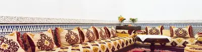 a row of pillows on a couch in a room at RIAD YOUSSEF in Fès