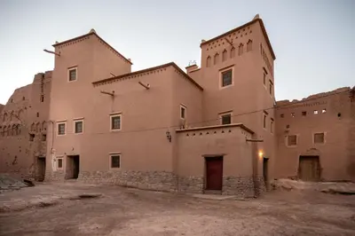 a large brick building with a lot of windows at Dar Bladi in Ouarzazate
