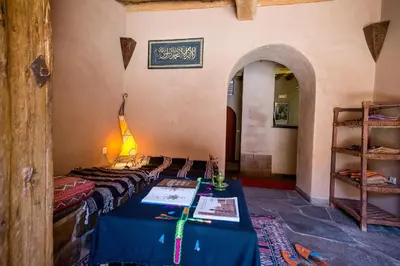 a room with a table with a blue table cloth at Dar Bladi in Ouarzazate