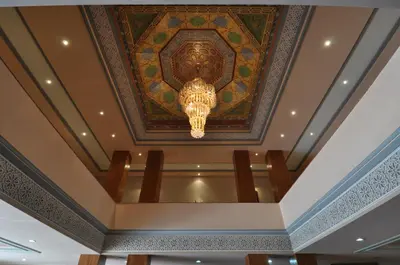 a ceiling with a chandelier in a building at Hôtel Wassim in Fès