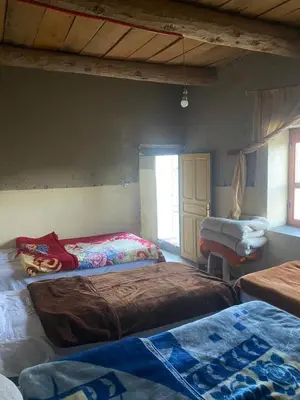 a bedroom with two beds in a room at Auberge Ouabas in Agoudim