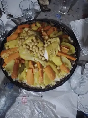 a pan filled with vegetables sitting on a table at Auberge Ouabas in Agoudim