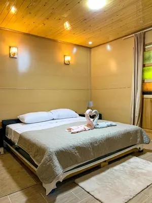 a bedroom with a bed with a stuffed animal on it at Chalet nina in Azrou
