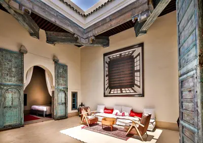 a living room with a couch and a table at Hotel & Spa Dar Bensouda in Fès