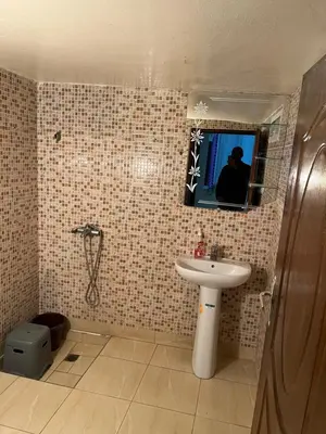 a bathroom with a sink and a mirror at Chez ZAKi in Meknès