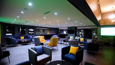 a waiting room with chairs and a projection screen at HOTEL BELLE VUE MEKNES in Meknès