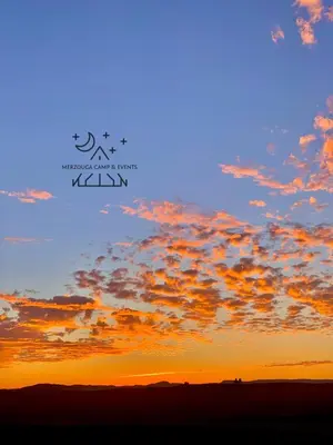 an image of a sunset sky with clouds at Merzouga Camp & Events in Merzouga