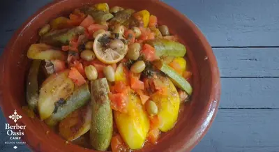 a bowl of food with vegetables and beans at Berber Oasis Camp in Kasr Bounou
