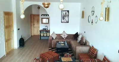 a living room with a couch and a table at Dar Yan in Er Rachidia